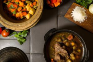 lamb potjie surrounded by vegetables